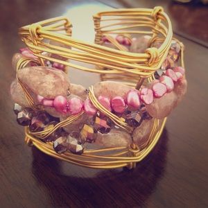 Gold bracelet with stone details